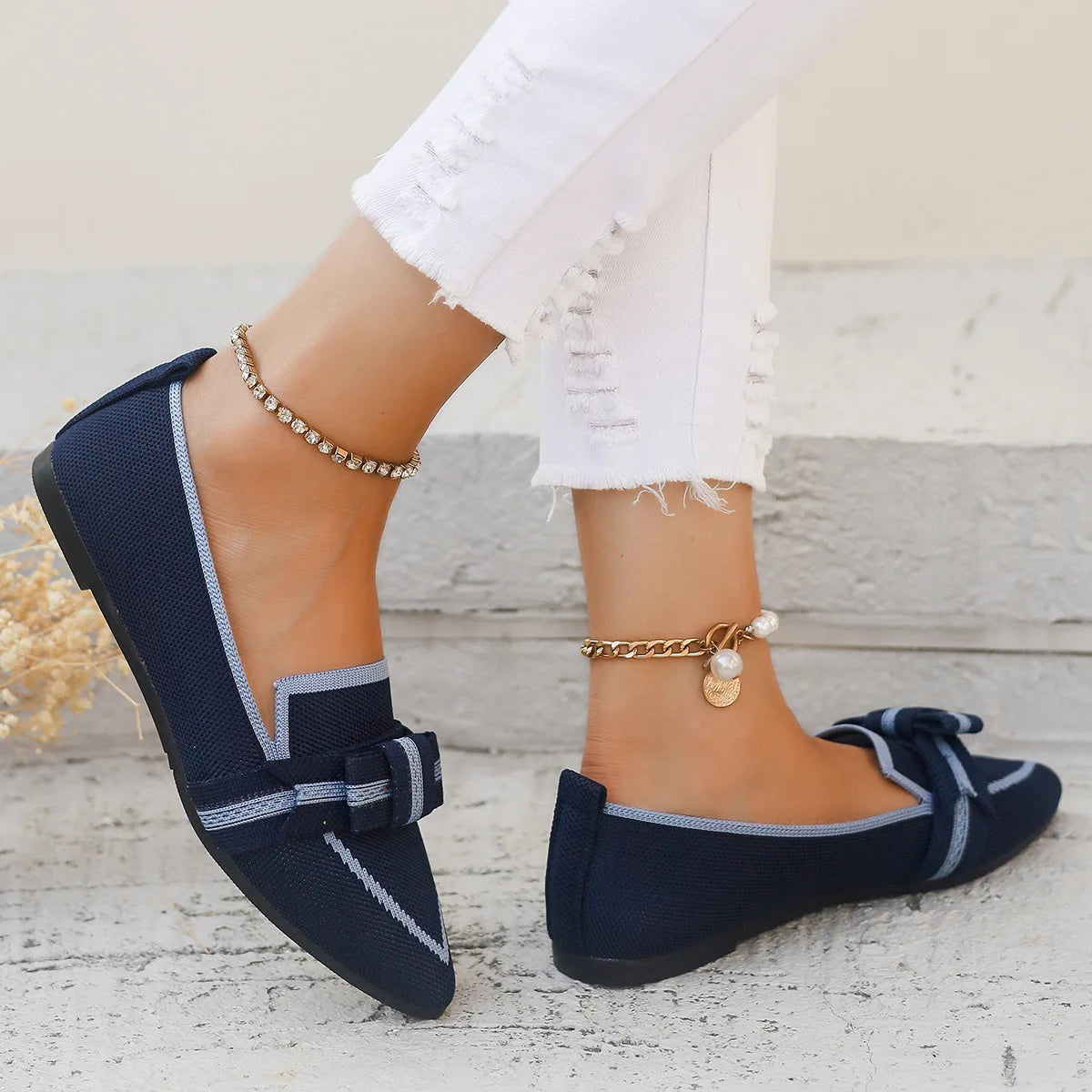 Navy flat shoes with a bow detail 