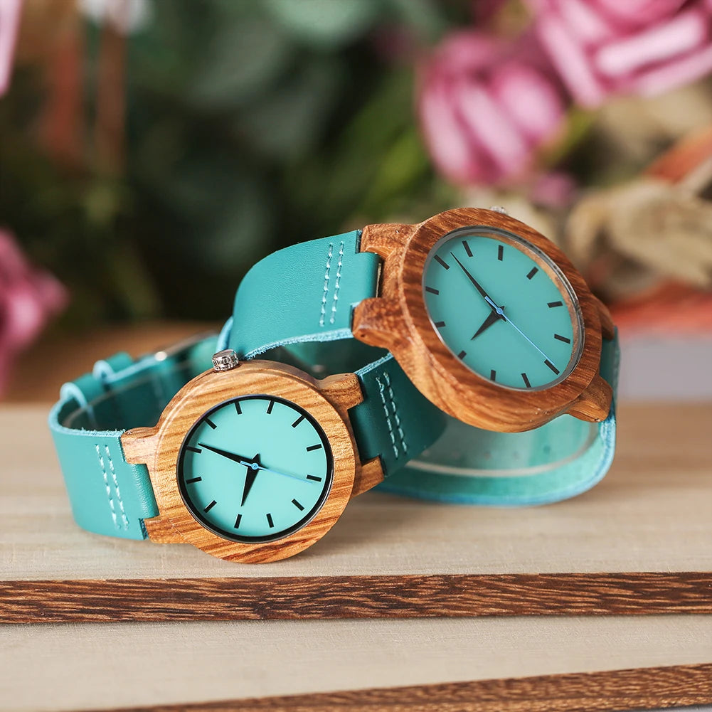 Two wooden watches on a wooden surface 