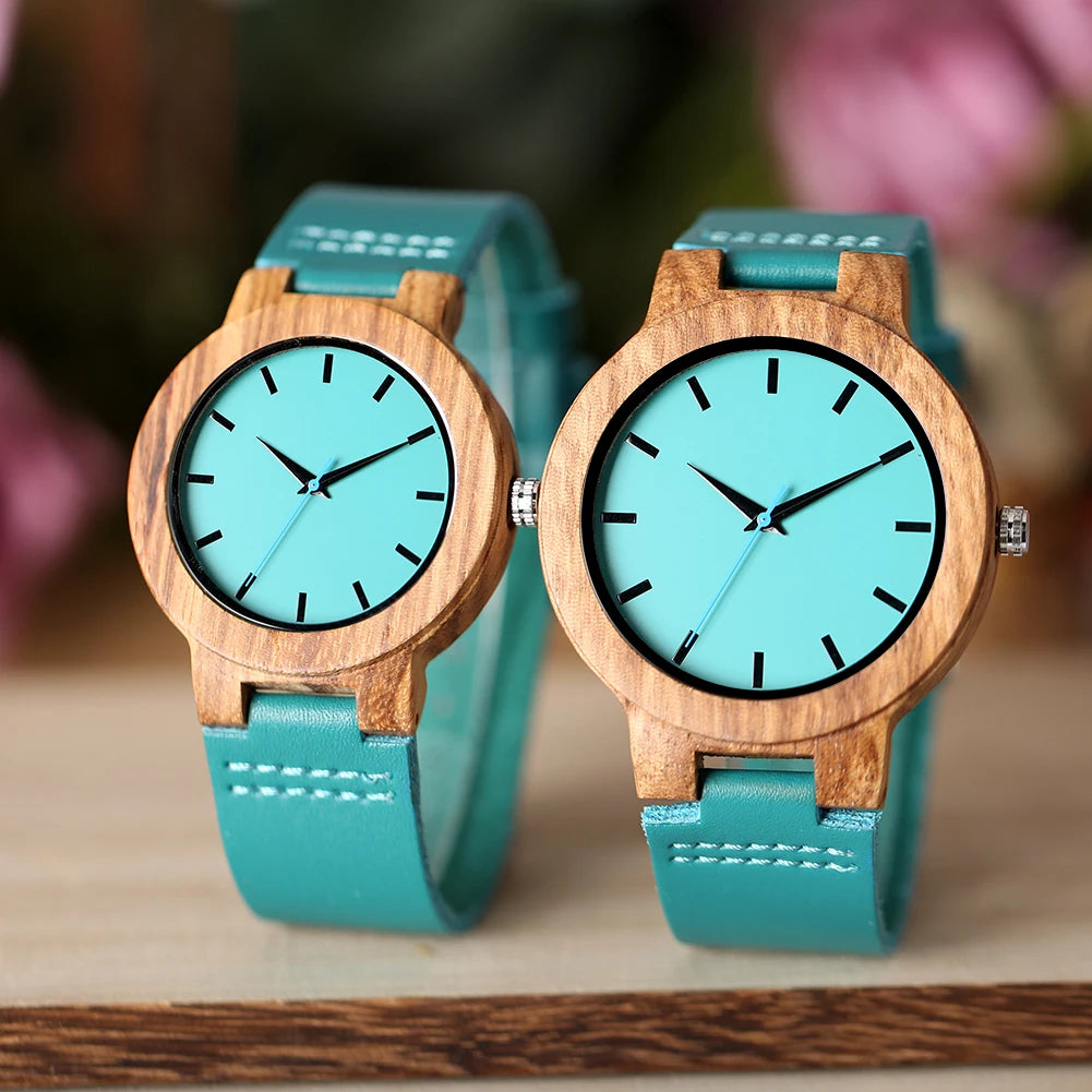 Two turquoise watches with wooden frames 